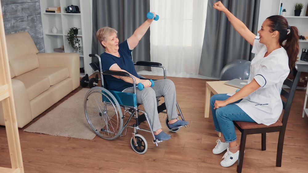 A woman in a wheelchair is doing exercises.