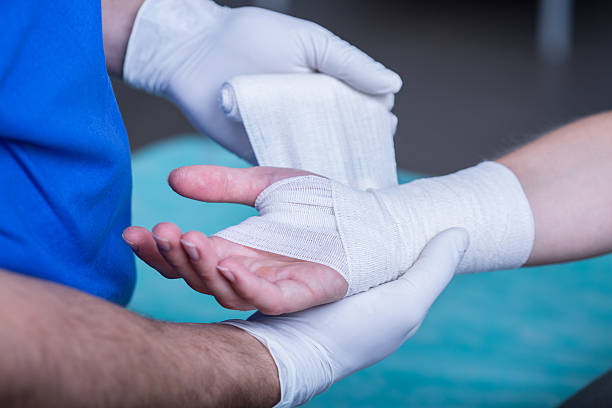 A person with white gloves holding onto something